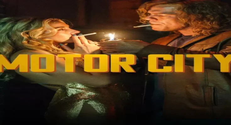 Alan Ritchson with long hair and a beard burning paper in Motor City movie review